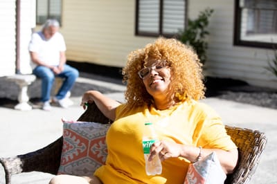 Resident enjoying time outdoors in the facility garden
