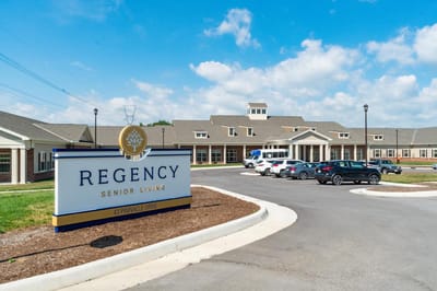 Exterior view of Regency Senior Living facility with sign