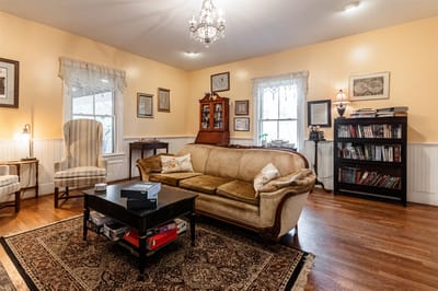 Cozy common area with seating and bookshelves