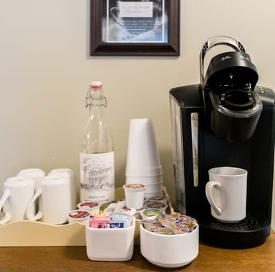 Coffee station with cups and condiments