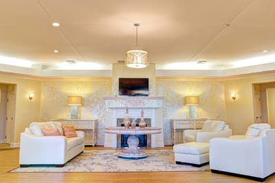 Bright common area with seating and decorative walls