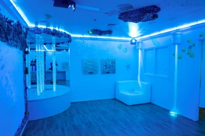 Brightly colored sensory room with aquatic theme