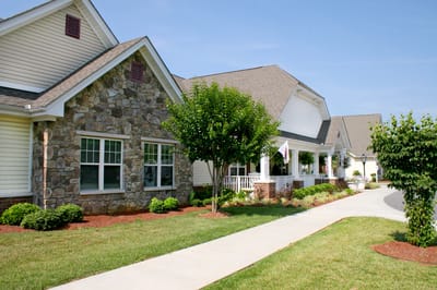 Exterior view of the Runk & Pratt facility with a walkway