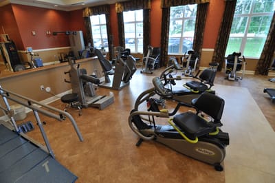 Exercise equipment in a well-lit rehabilitation gym