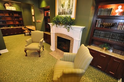 Cozy common area with chairs by the fireplace