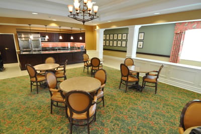Dining area with tables and chairs in a warm setting