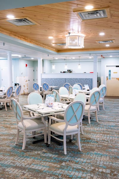 Bright dining room with elegantly set tables