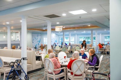 Residents enjoying a meal in the dining room