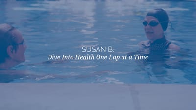 Two people engaging in a swimming activity
