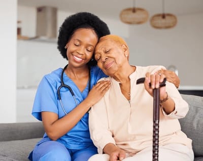 A caregiver and a senior resident sharing a moment