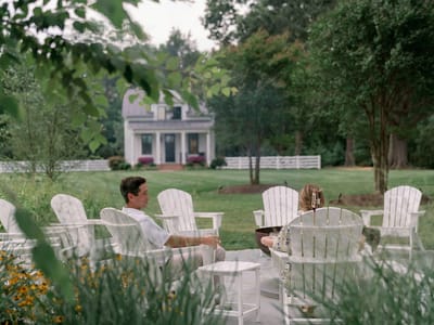 Two residents enjoying the garden seating area