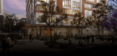 Outdoor view of facility with residents and staff.