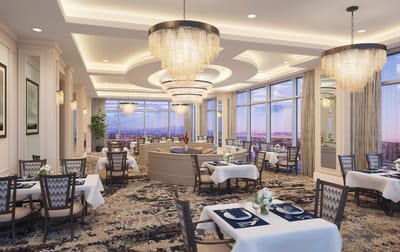 Elegant dining room with chandeliers and large windows