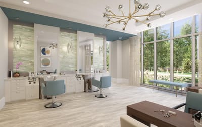 Bright salon area with modern furnishings and large windows