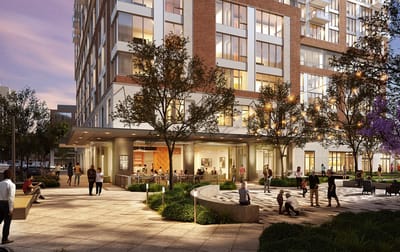 Exterior view of a senior living facility with outdoor spaces