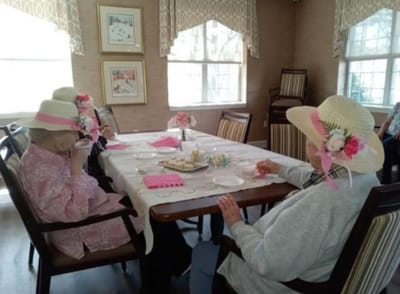 Residents enjoying a tea party in a common area