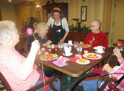 Residents enjoying a meal and activities together