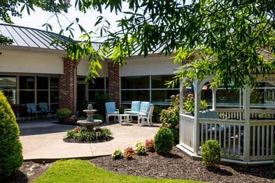 Outdoor garden area with seating and a fountain