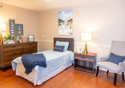 Well-furnished resident room with a bed and decor