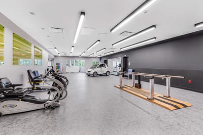 Interior view of a rehabilitation gym with exercise equipment