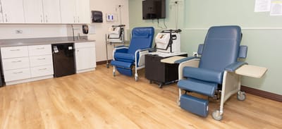 Interior view of a treatment area with medical chairs