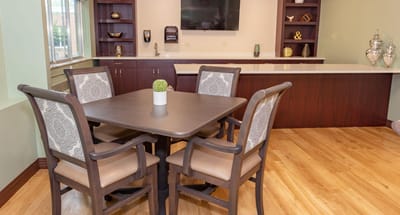Bright common area with table and chairs