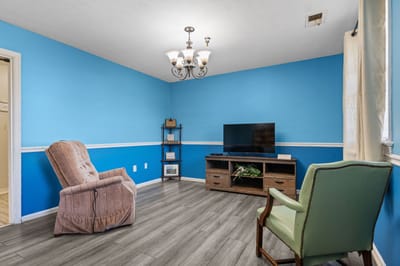 Comfortable common area with blue walls and seating