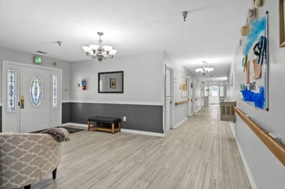 Bright interior hallway with seating and artwork