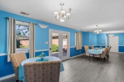 Bright common area with tables and chairs