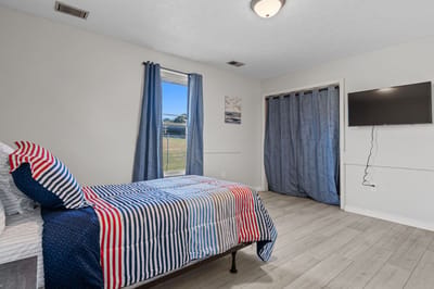 Private resident room with bed and TV