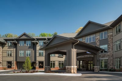 Front entrance of a senior living facility with modern architecture