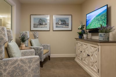 Cozy common area with comfortable seating and artwork