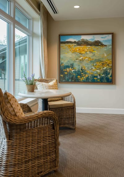 Cozy seating area with artwork and natural light