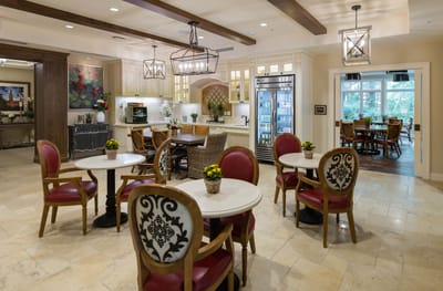 Bright and welcoming common area with dining tables