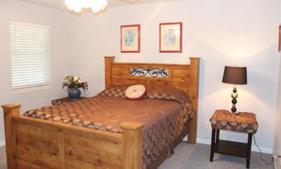 Cozy resident bedroom with wooden furniture