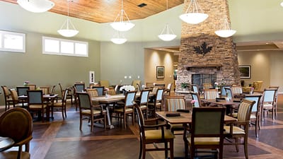Bright dining area with wooden tables and chairs