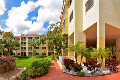Entrance of Oakmont at Gordon Park with gardens and buildings