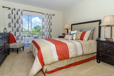 Stylish private resident room with bedding and natural light