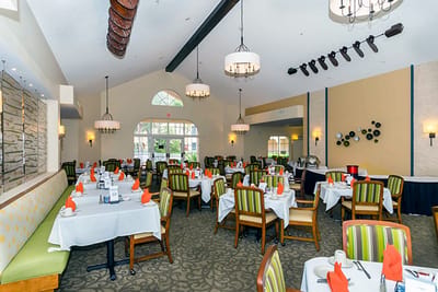 Interior view of a dining room with neatly set tables
