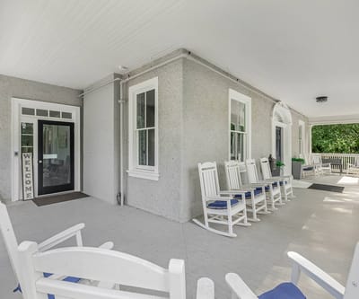 Porch area with rocking chairs in a welcoming setting