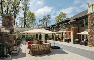 Outdoor patio area with seating and umbrellas