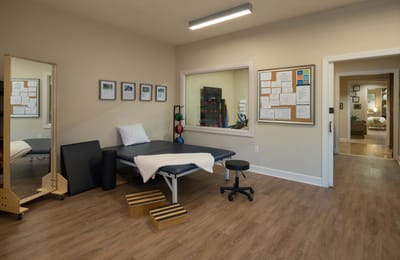 Rehabilitation therapy room with equipment and documentation