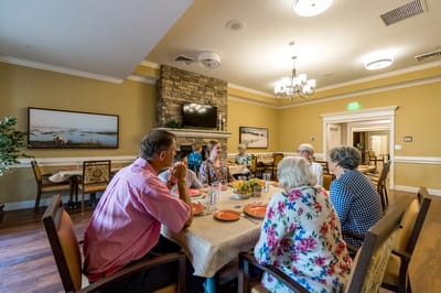 Residents enjoying a meal in a cozy dining area
