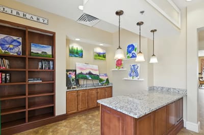 Interior common area with bookshelves and artwork