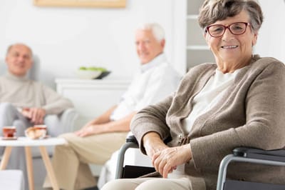 Residents enjoying conversation in a cozy common area
