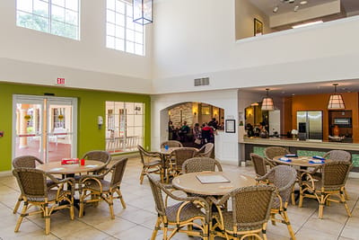 Bright common area with residents engaged in activities