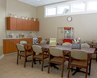 Interior activity room with tables and chairs
