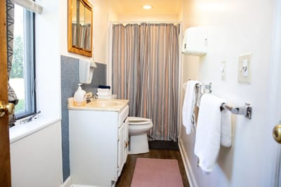 Clean restroom with towels and toiletries