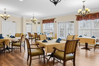 Dining room setup with tables and chairs