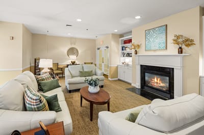 Interior common area with seating and a fireplace